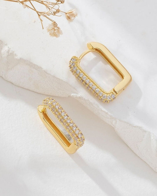 Minimalist gold earrings for women close up